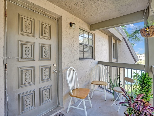 view of exterior entry with covered porch