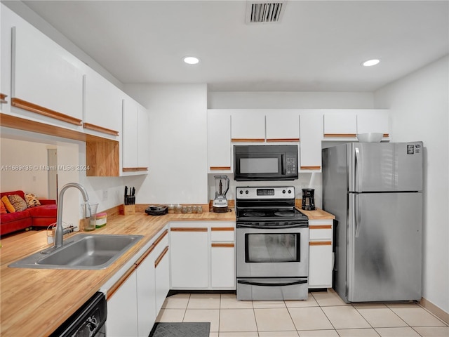 kitchen with white cabinetry, sink, and black appliances