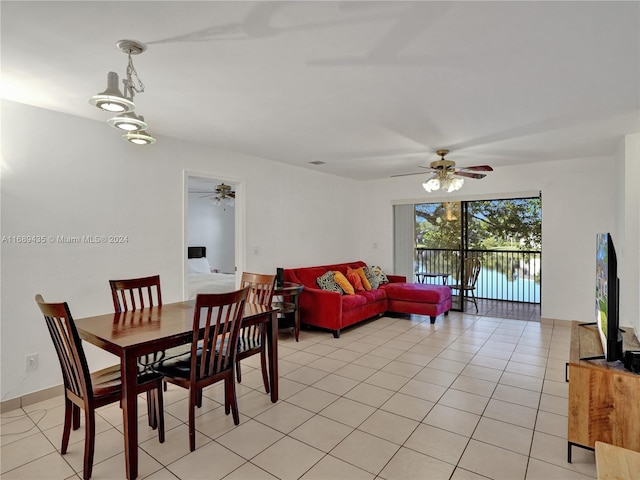 tiled dining space featuring ceiling fan