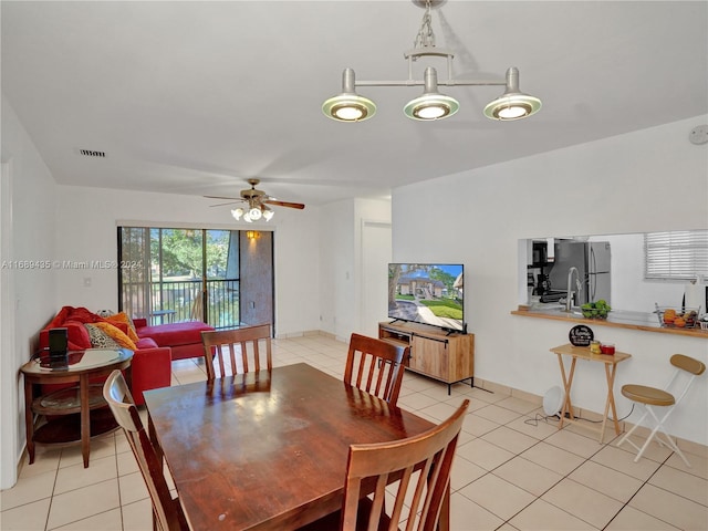 dining area featuring ceiling fan and light tile patterned flooring