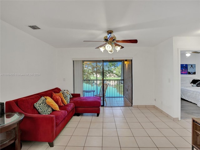 living room with light tile patterned floors and ceiling fan