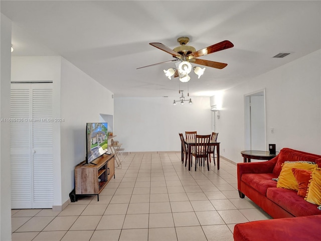 tiled living room featuring ceiling fan