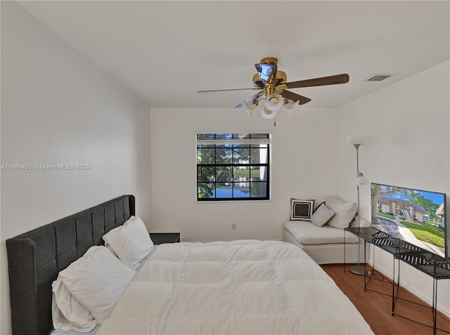 bedroom featuring hardwood / wood-style floors and ceiling fan