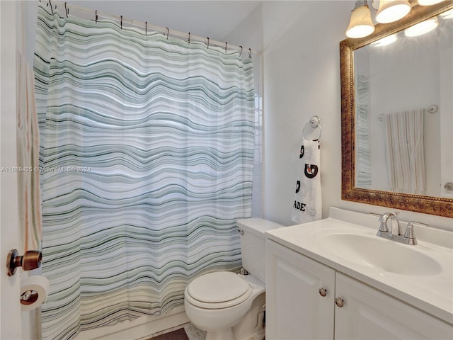 bathroom with vanity, toilet, and walk in shower