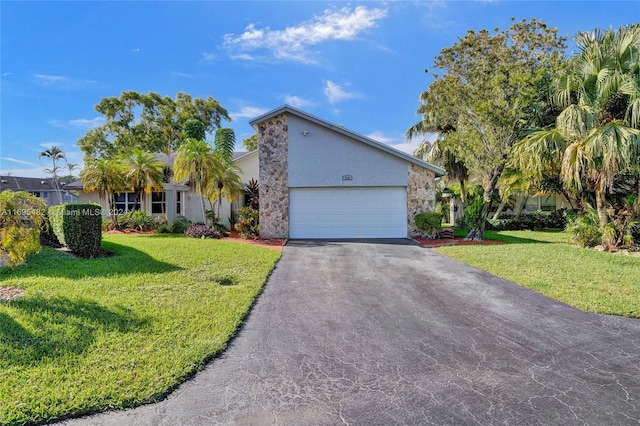 view of front of house featuring a garage and a front yard