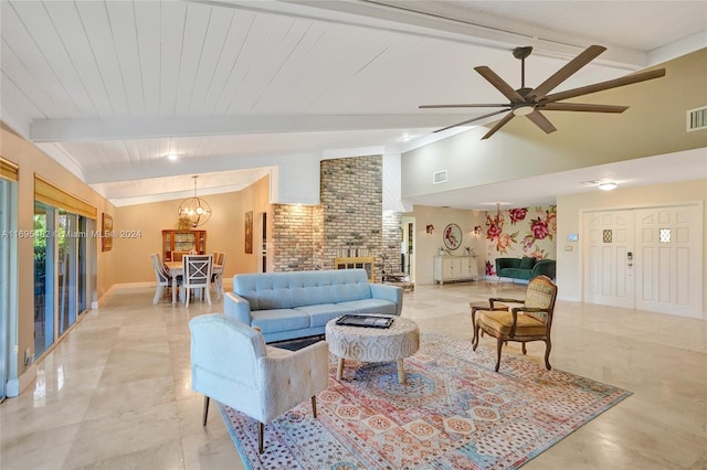 living room featuring ceiling fan with notable chandelier, vaulted ceiling with beams, and a fireplace