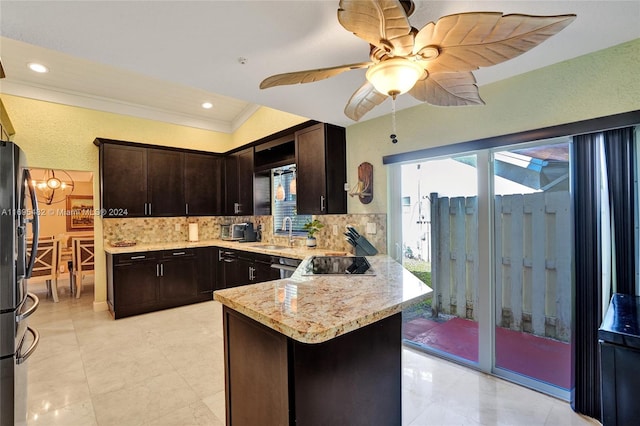 kitchen featuring dark brown cabinetry, sink, tasteful backsplash, kitchen peninsula, and ornamental molding