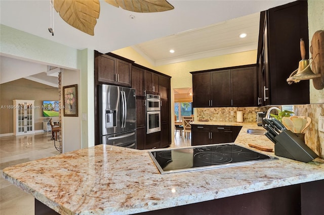 kitchen with kitchen peninsula, dark brown cabinetry, vaulted ceiling, and appliances with stainless steel finishes