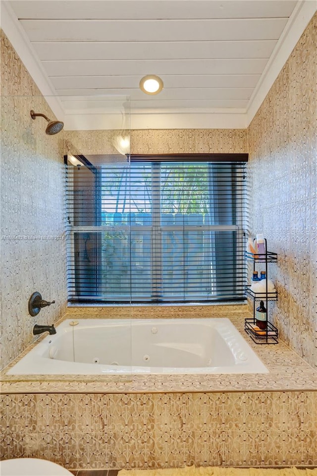 bathroom featuring tiled shower / bath combo and crown molding