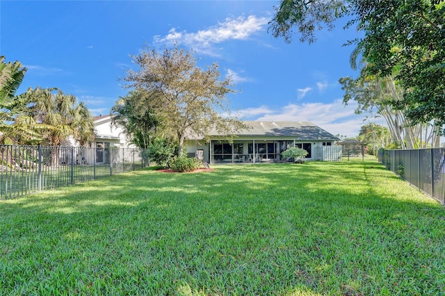 view of yard featuring a sunroom