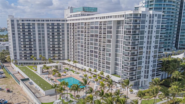 view of building exterior featuring a community pool