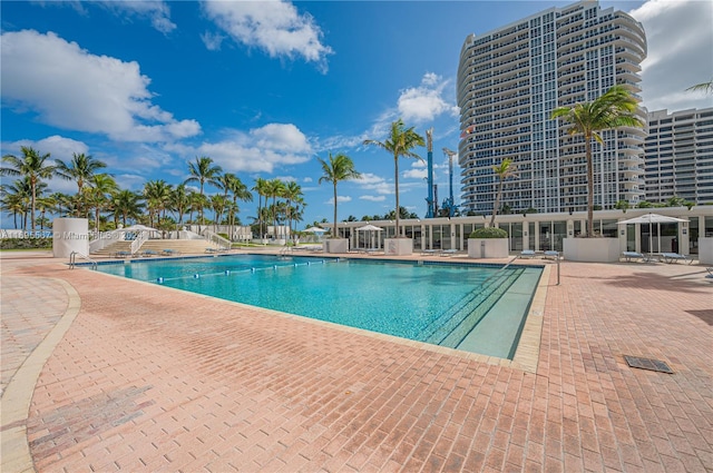 view of swimming pool featuring a patio