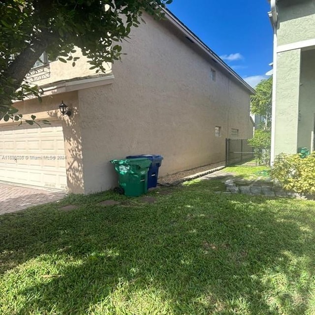 view of side of home featuring a yard