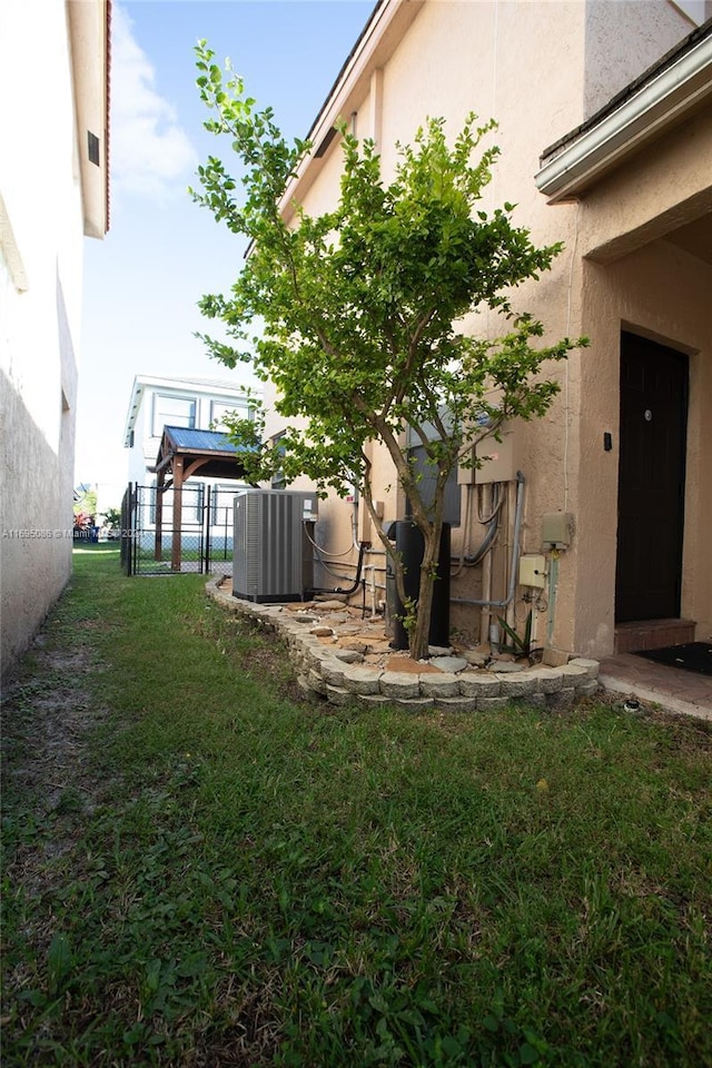 view of yard with central AC unit