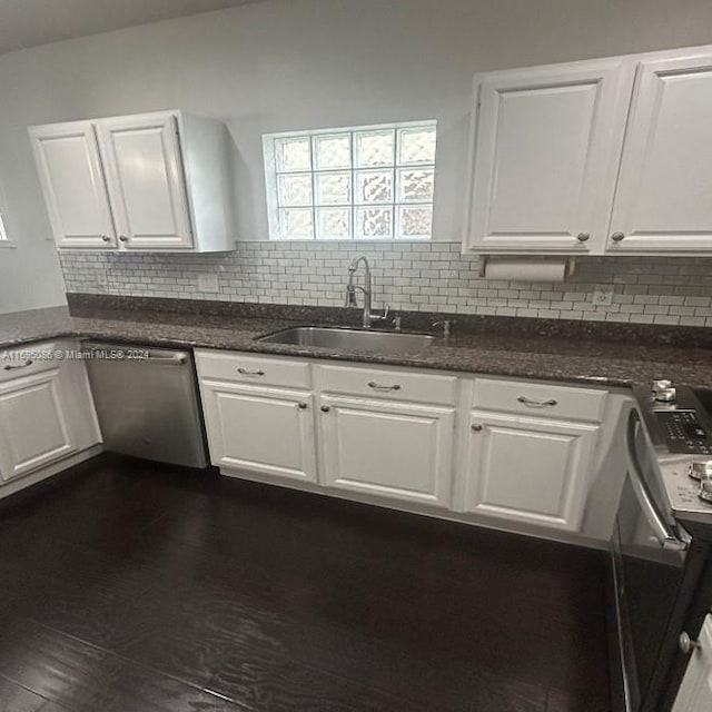 kitchen with dishwasher, sink, dark hardwood / wood-style floors, decorative backsplash, and white cabinets