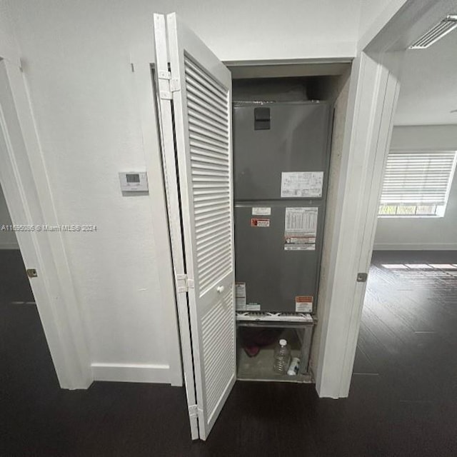 utility room featuring heating unit