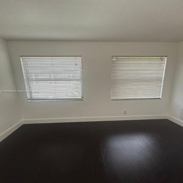 spare room featuring hardwood / wood-style floors