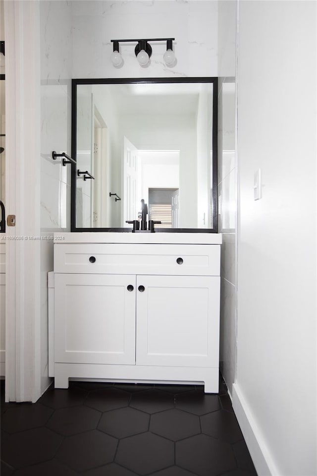 bathroom featuring tile patterned floors and vanity