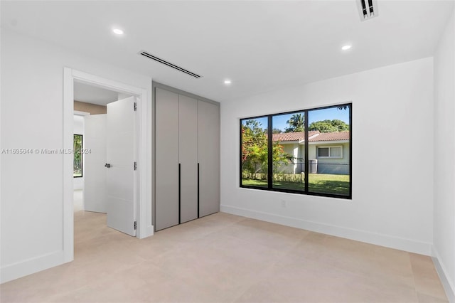 unfurnished bedroom with a closet