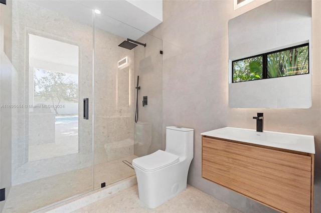 bathroom featuring vanity, toilet, an enclosed shower, and a healthy amount of sunlight