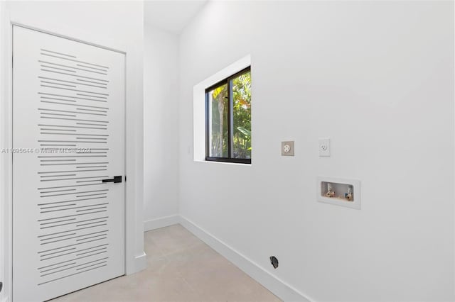 washroom with hookup for an electric dryer and washer hookup