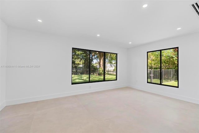 spare room featuring a wealth of natural light