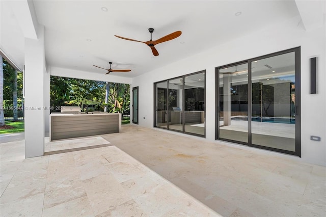 view of patio featuring ceiling fan