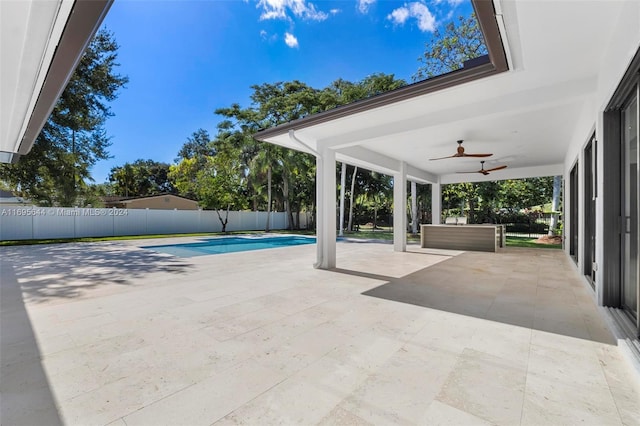 view of pool featuring ceiling fan and a patio area