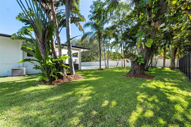 view of yard with central AC