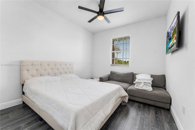 bedroom with ceiling fan and dark hardwood / wood-style flooring