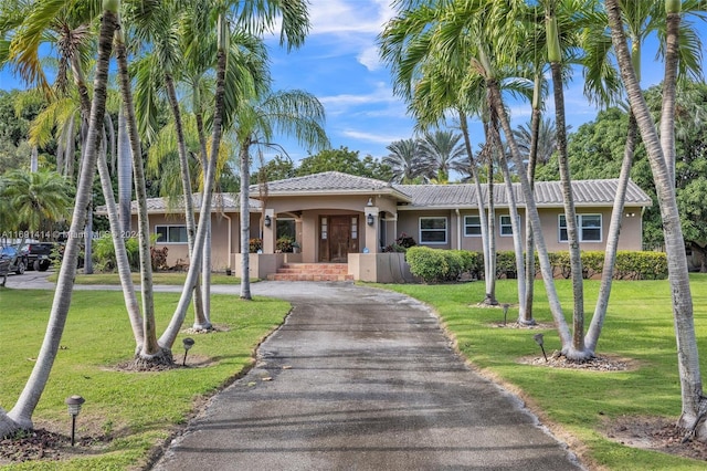 view of front of home with a front yard