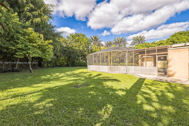 view of yard with a lanai