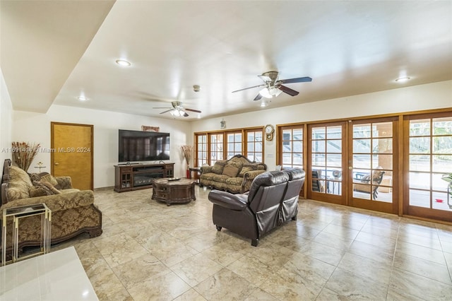 living room featuring french doors and ceiling fan