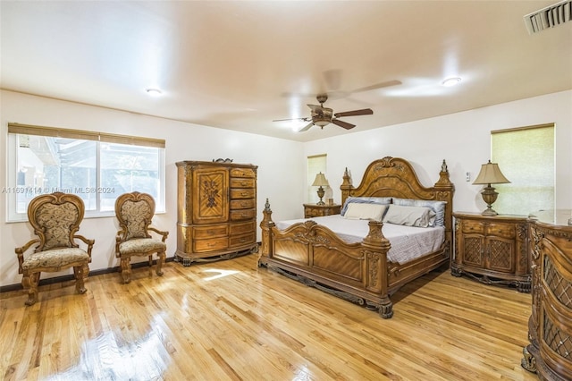 bedroom with ceiling fan and light wood-type flooring