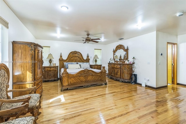 bedroom with ceiling fan and wood-type flooring