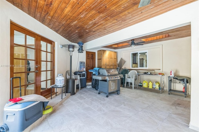 interior space with ceiling fan and french doors