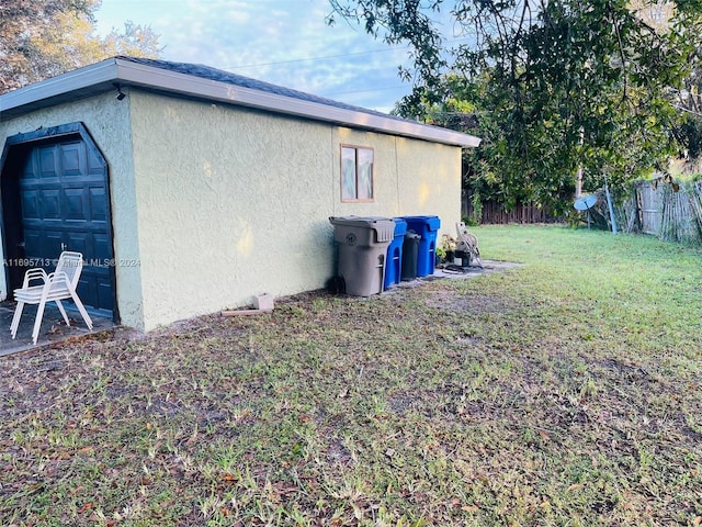 view of property exterior featuring a lawn