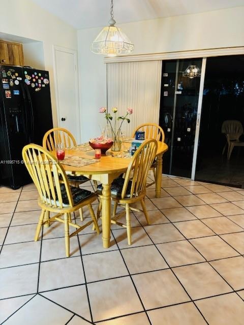 dining space with tile patterned flooring