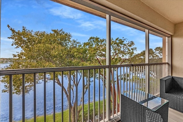 balcony featuring a water view