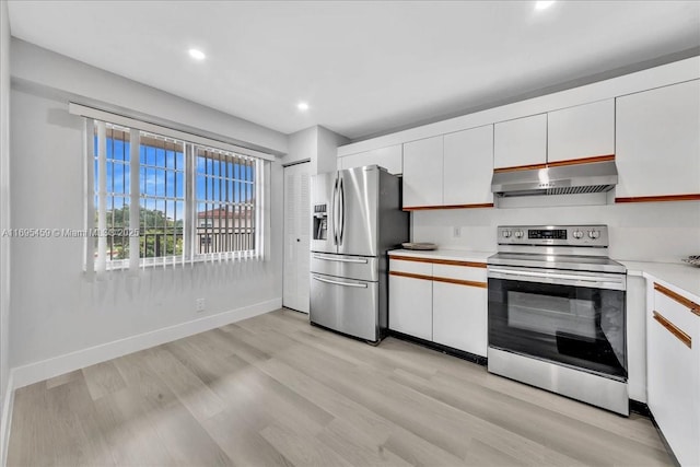 kitchen featuring white cabinetry, light wood-type flooring, and appliances with stainless steel finishes