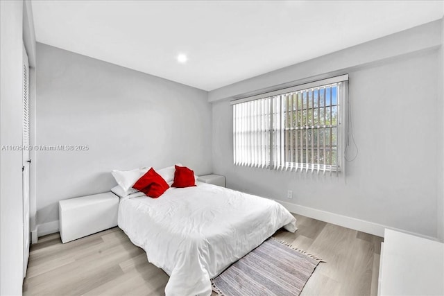 bedroom with light hardwood / wood-style floors