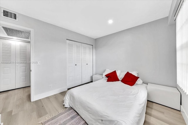 bedroom featuring light hardwood / wood-style flooring and a closet