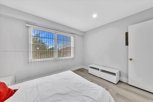 bedroom with wood-type flooring