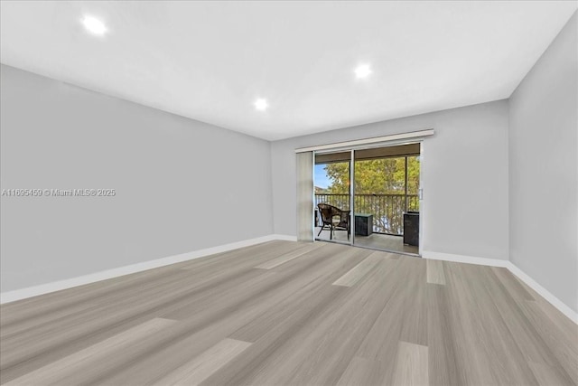 unfurnished room featuring light hardwood / wood-style flooring