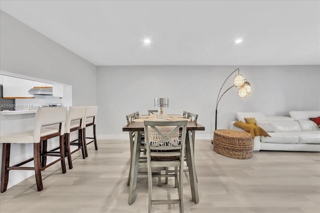 dining area featuring light wood-type flooring