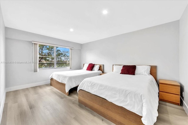 bedroom with light hardwood / wood-style flooring