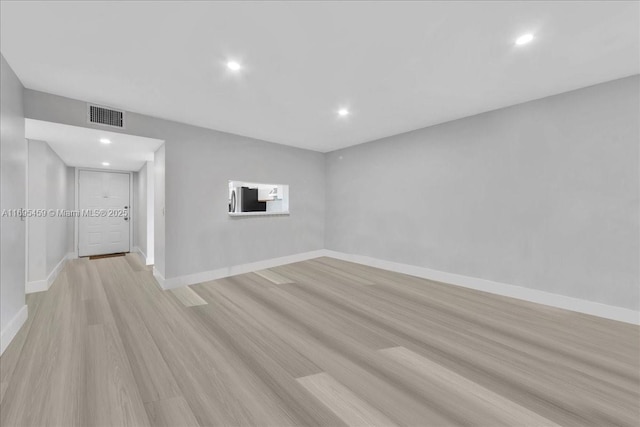 unfurnished room featuring light hardwood / wood-style flooring