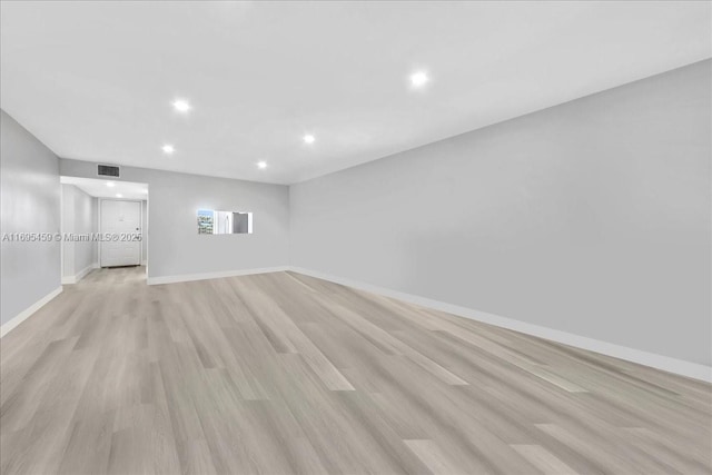 empty room with light hardwood / wood-style floors