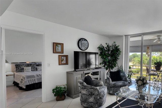 living room featuring ceiling fan and light tile patterned floors