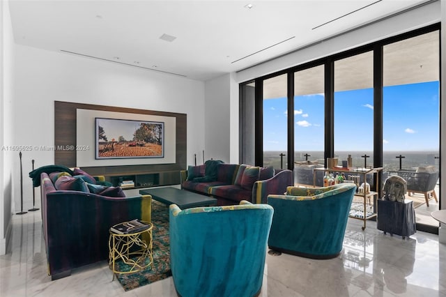 living room with expansive windows and a water view